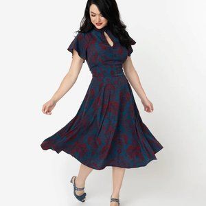 Unique Vintage teal dress with red print.